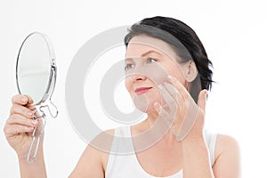 Beauty middle age woman with mirror. Face portrait. Spa and anti aging concept Isolated on white background. Plastic surgery