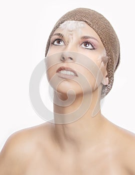 Beauty model in basic makeup with burlap headband