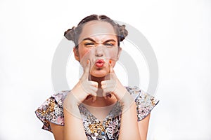 Beauty Model Girl portrait isolated on white. Beautiful Joyful teen girl with freckles, funny hairstyle and yellow and