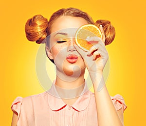 Beauty model girl takes juicy oranges