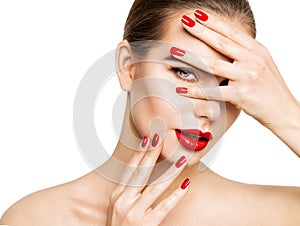 Beauty Model Make up and Red Nail Polish. Woman Face Skin Care Cosmetics. Fashion Girl Portrait with Red Lips and Hands Manicure
