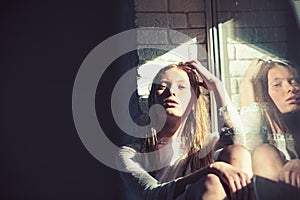 Beauty model with wet blond hair. Sensual woman relax at window. Woman with young skin face. Albino girl with look