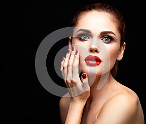 Beauty Model Woman with Long Brown Wavy Hair. Healthy Hair and Beautiful Professional Makeup. Red Lips and Smoky Eyes