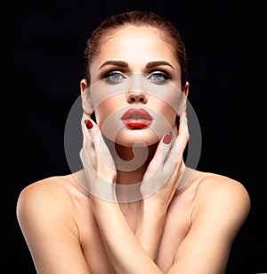 Beauty Model Woman with Long Brown Wavy Hair. Healthy Hair and Beautiful Professional Makeup. Red Lips and Smoky Eyes