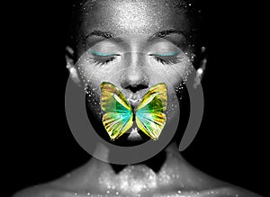 Beauty model woman with yellow-green butterfly