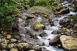 The Beauty of Natural Patterns: Slow Shutter Speed Images of Water Flowing Among the Rocks
