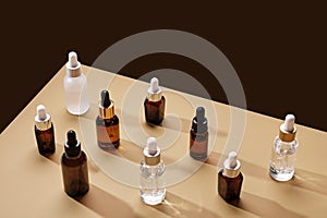 Beauty natural skincare products. Set of Serum or Collagen Dropper Bottles on geometric background