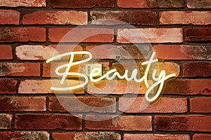 beauty - neon sign on a brick wall in a spa salon