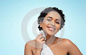 young african american woman with bath towel