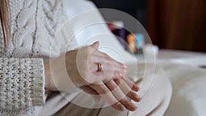 Beauty, people and health concept - Clean well-groomed hands of a young woman, applying hand cream, skin care on white