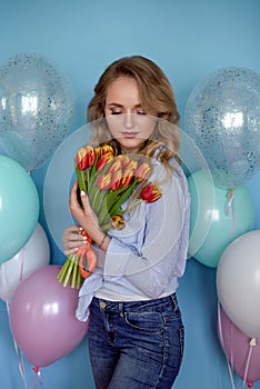 beauty, people, style, holidays and fashion concept - happy young woman or teen girl in pink dress with helium air balloons