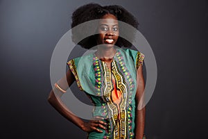 Beauty photo of young elegant african american woman with afro. wearing pearls. Looking at camera. Glamour makeup