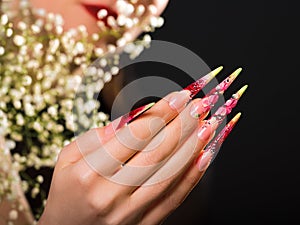 Beauty pink floral design nails.