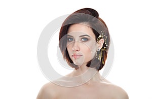 Beauty portrait of adult adorable fresh looking brunette woman with gorgeous makeup diy headpiece bob hairdo posing against isolat