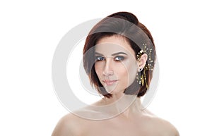 Beauty portrait of adult adorable fresh looking brunette woman with gorgeous makeup diy headpiece bob hairdo posing against isolat