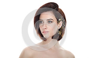 Beauty portrait of adult adorable fresh looking brunette woman with gorgeous makeup diy headpiece bob hairdo posing against isolat