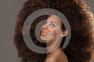 Beauty portrait of attractive woman in afro hairstyle.