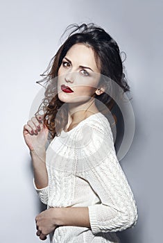 Beauty portrait of a attractive woman with hairtstyle and makeup, studio shooting. White background. Vertical view.