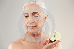 Beauty portrait of a beautiful half naked elderly woman