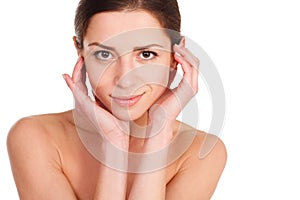 Beauty Portrait. Beautiful Spa Woman Touching her Face. Perfect