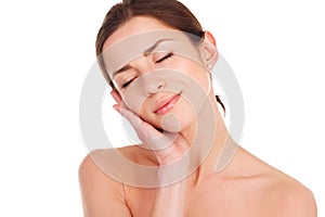 Beauty Portrait. Beautiful Spa Woman Touching her Face. Perfect