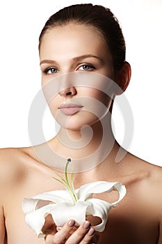 Beauty Portrait. Beautiful Spa Woman Touching her Face. Perfect