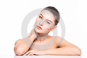 Beauty Portrait. Beautiful Spa Woman Touching her Face. Perfect Fresh Skin. Isolated on White Background. Pure Beauty