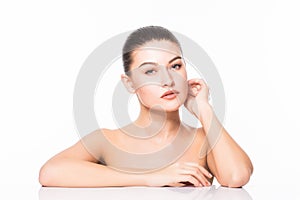 Beauty Portrait. Beautiful Spa Woman Touching her Face. Perfect Fresh Skin. Isolated on White Background. Pure Beauty