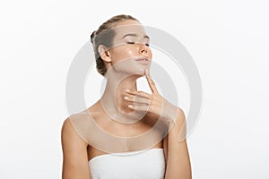 Beauty Portrait. Beautiful Spa Woman Touching her Face. Perfect Fresh Skin. Pure Beauty Model Girl. Youth and Skin Care