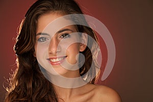 Beauty Portrait of beautiful teenage girl red blue background