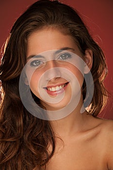 Beauty Portrait of beautiful teenage girl red blue background