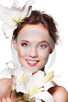 Beauty portrait of beautiful woman with the lily isolated on white