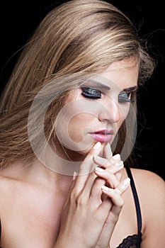 Beauty portrait of blonde girl with sparkly eye shadow