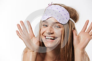 Beauty portrait of blonde half-naked woman wearing sleeping mask smiling