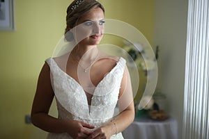 Beauty portrait of bride wearing fashion wedding dress with luxury delight make-up and hairstyle