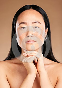 Beauty, portrait or face of Japanese woman or model in with glowing skin isolated on studio background. Tokyo, skincare