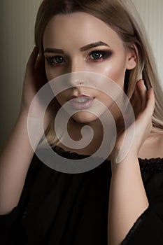 Beauty portrait of fashionable blonde lady with professional makeup