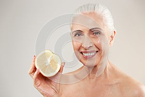 Beauty portrait of a happy half naked elderly woman