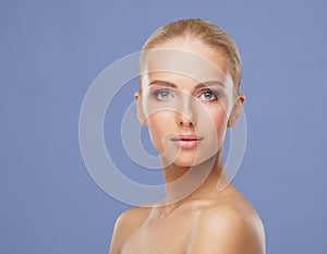 Beauty portrait of healthy and attractive woman. Human face in a concept of spa, skin care, cosmetics, make-up