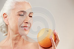 Beauty portrait of a lovely half naked elderly woman