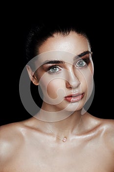 Beauty Portrait of Pretty Woman with Strobing Makeup. Wet Body E