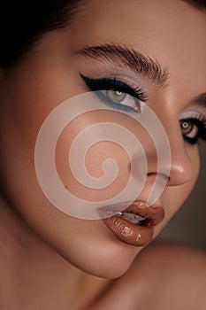 Beauty portrait with professional blue makeup. Fashion portrait