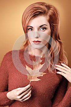 Beauty portrait redhead woman, autumn leafs,people