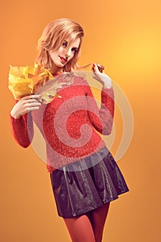 Beauty portrait redhead woman autumn leafs,vintage