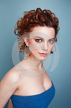 Beauty portrait of a redhead woman with freckles