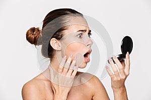 Beauty portrait of a shocked attractive half naked woman