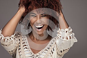 Beauty portrait of smiling girl with afro hairstyle.