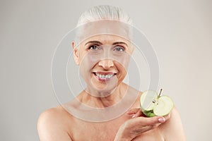 Beauty portrait of a smiling half naked elderly woman