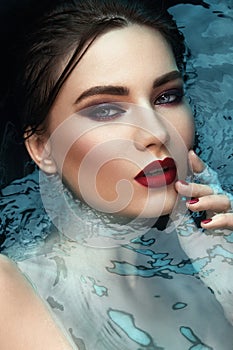 Beauty portrait in water, fashion vogue style shoot