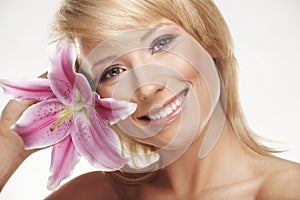 Beauty portrait of a woman with a flower